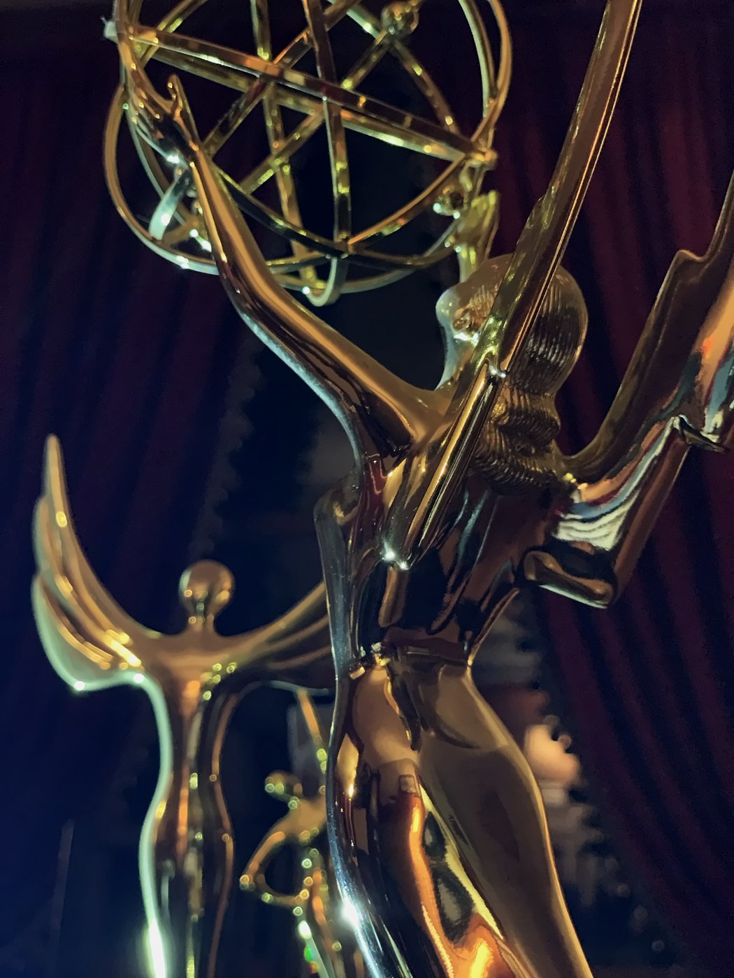 Award statuettes on a shelf